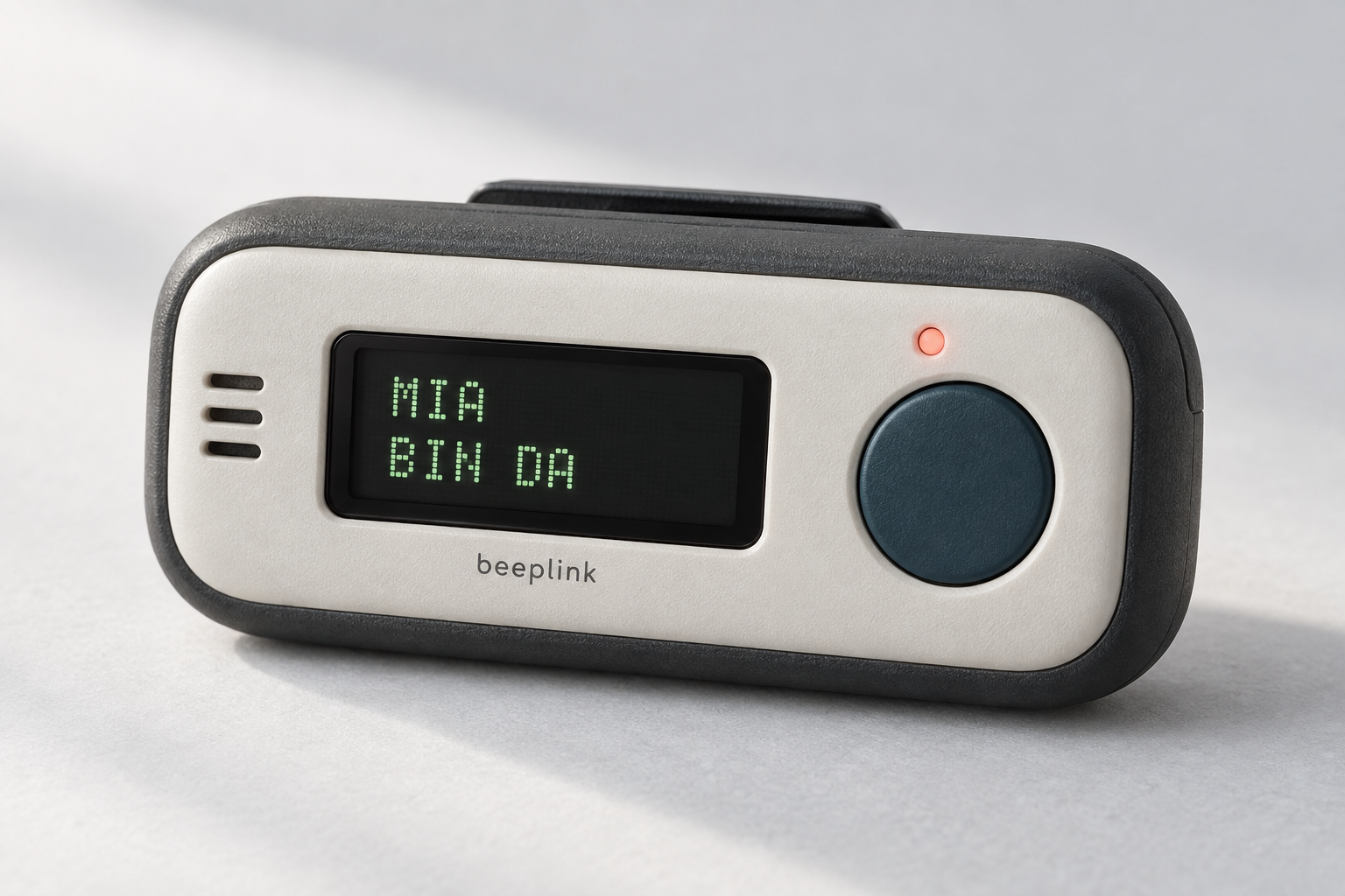Beeplink-Designkonzept mit hellem Gehäuse, kleinem Display und großem petrolfarbenem Knopf.